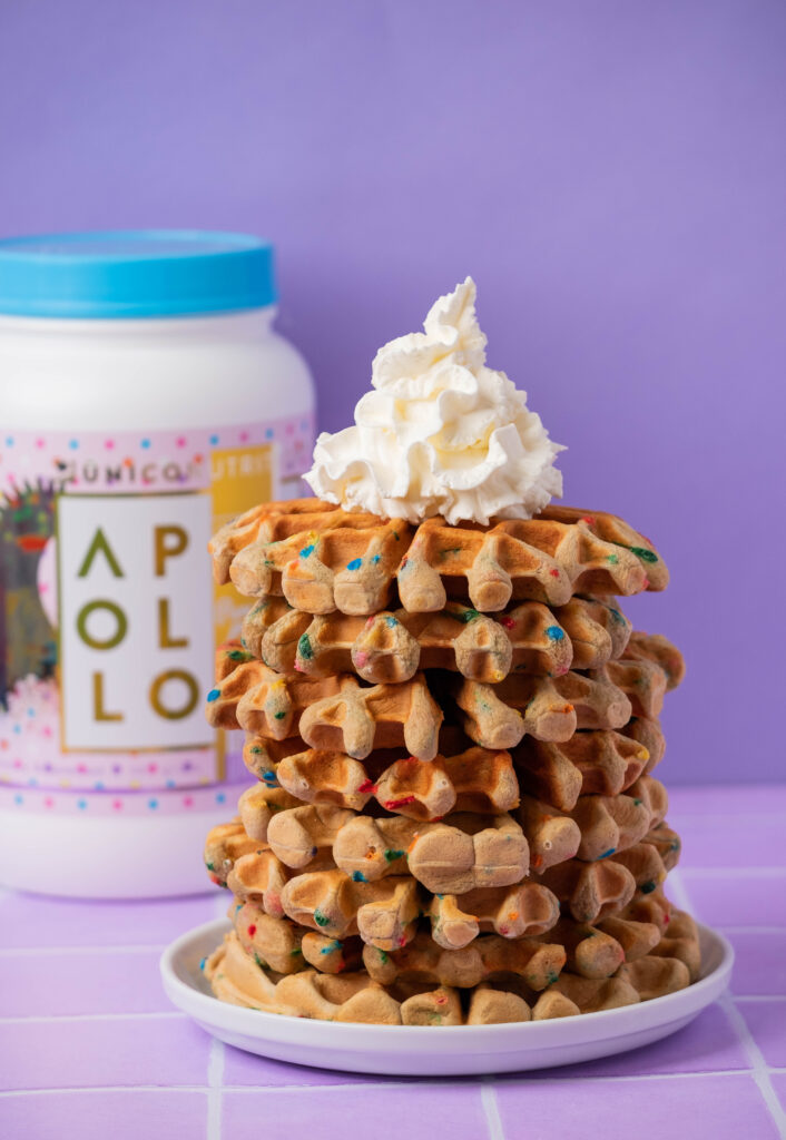 stack of protein waffles with whipped cream
